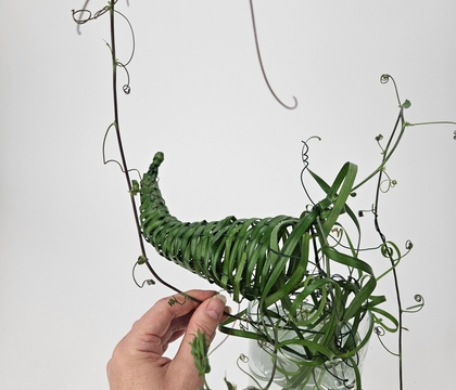 Weave a delicate horn of plenty that looks like it was foraged in an enchanted forest