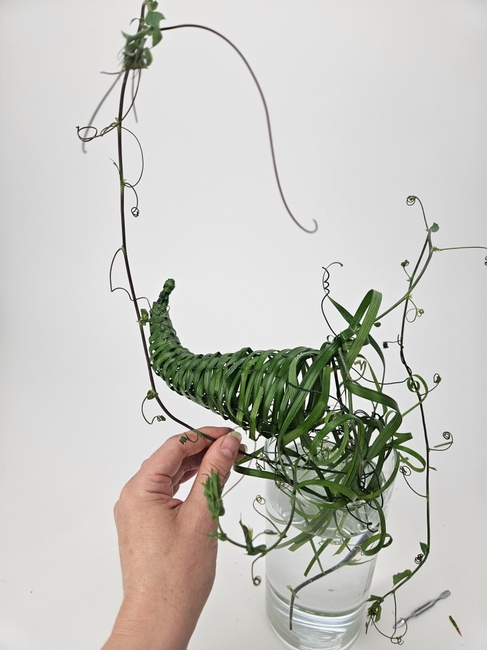 Weave a delicate horn of plenty that looks like it was foraged in an enchanted forest