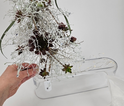 Clumps of chocolate kisses on a crafted silver bush Christmas Tree