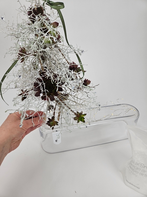 Clumps of chocolate kisses on a crafted silver bush Christmas Tree
