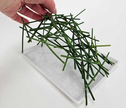 Stack miniature roses on to stacked grass snippets