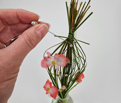 Save a snipped grass bundle to tie into a flower frog