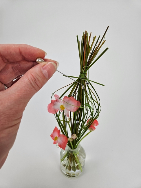 Save a snipped grass bundle to tie into a flower frog
