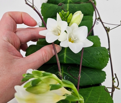 A roll-and-tuck to stay hydrated leaf armature that gives those tendrils time to grow into the design