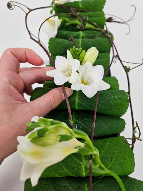 A roll-and-tuck to stay hydrated leaf armature that gives those tendrils time to grow into the design