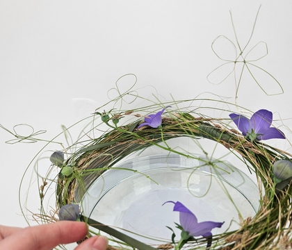 Knot some knots to elevate a traditional knotted butterfly to slip into a messy grass sheath frame
