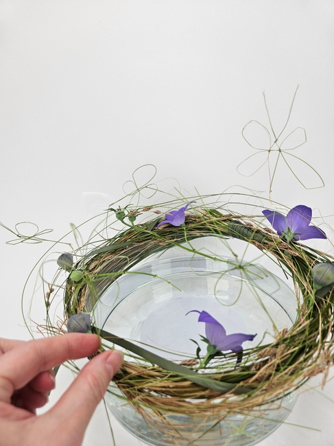 Knot some knots to elevate a traditional knotted butterfly to slip into a messy grass sheath frame